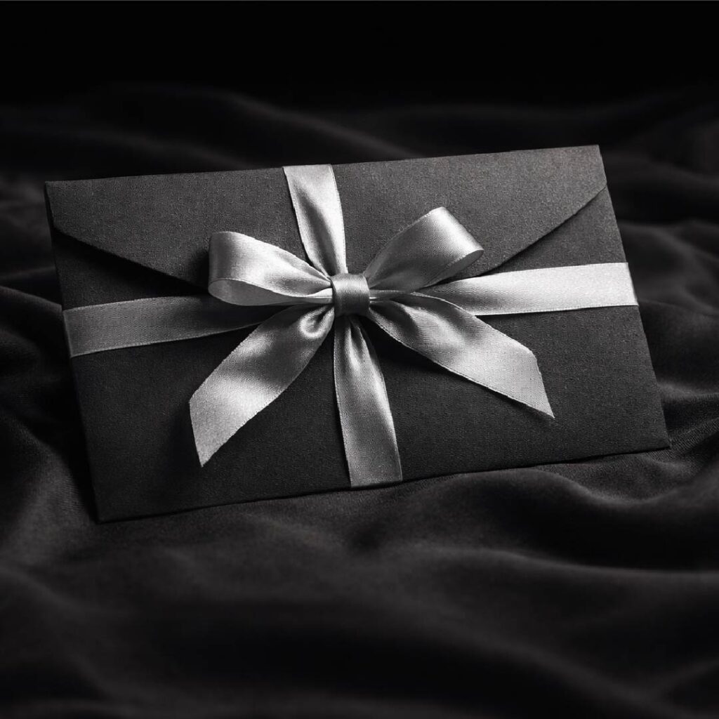 gift voucher limerick black envelope with silver ribbon